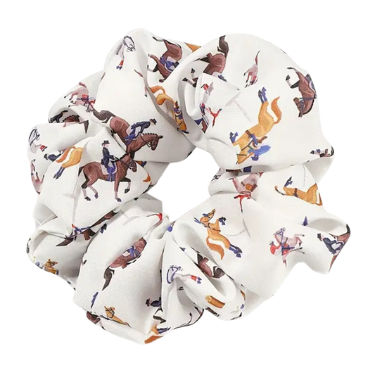 White scrunchie with horse and rider pattern on a white background